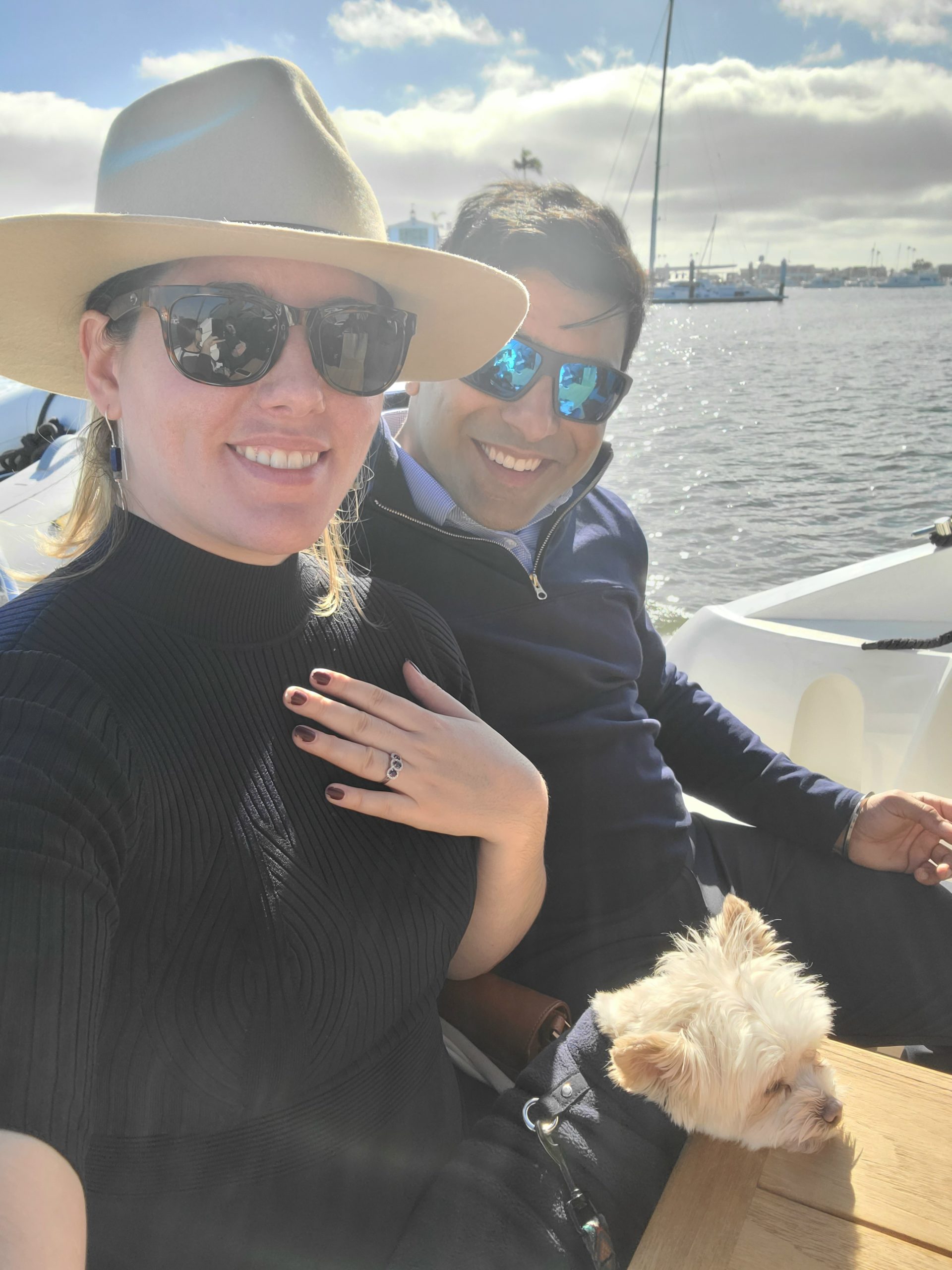 Michelle Mealer with her fiance showing of her engagement ring