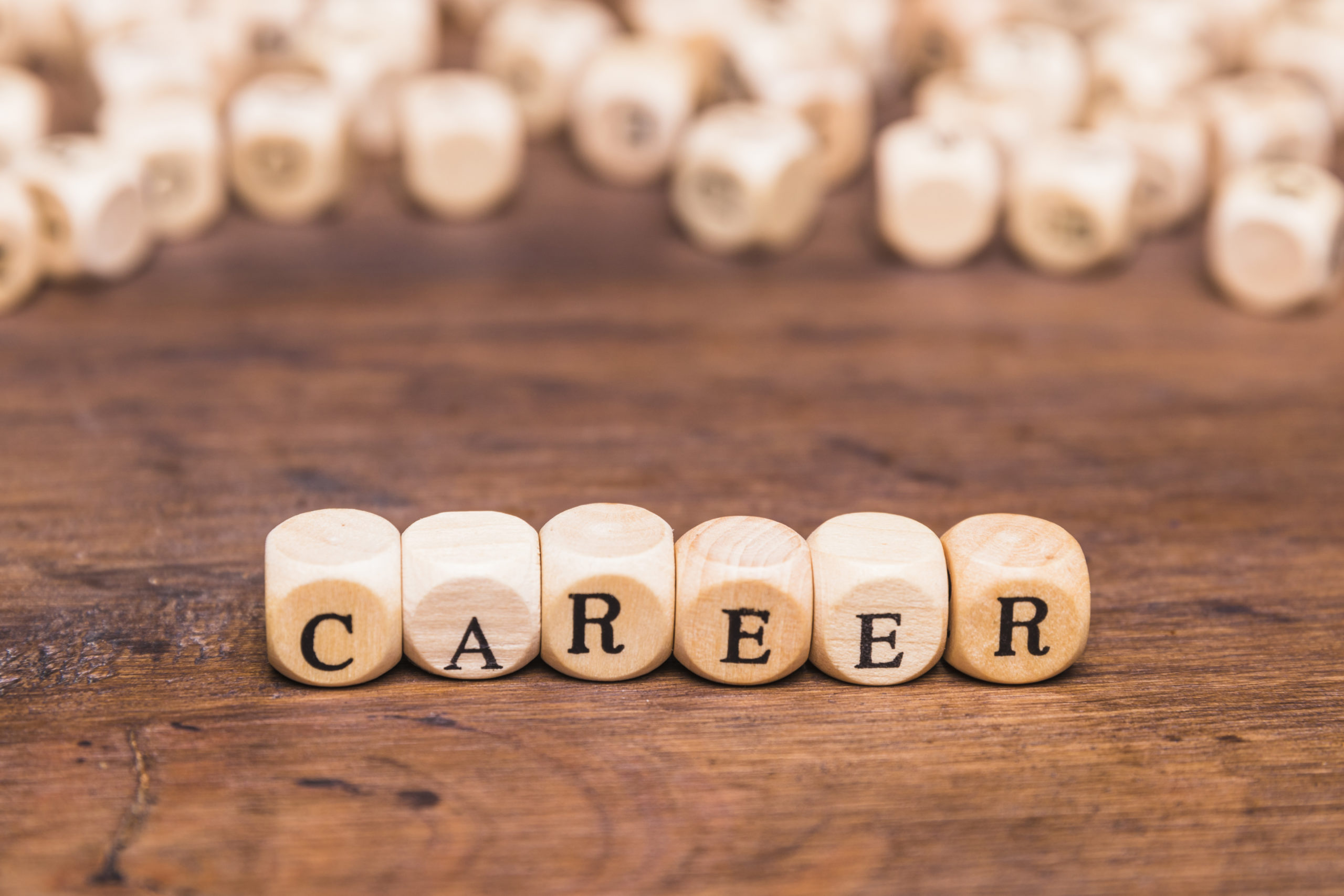 wooden dice spelling "career"