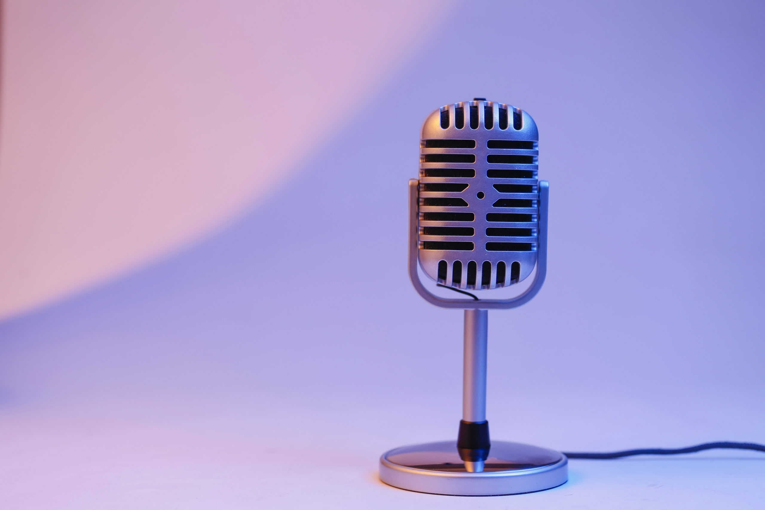 retro microphone isolated on color background