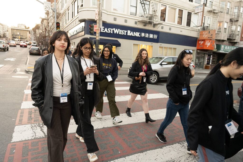 Students cross the street in Downtown San Francisco.
