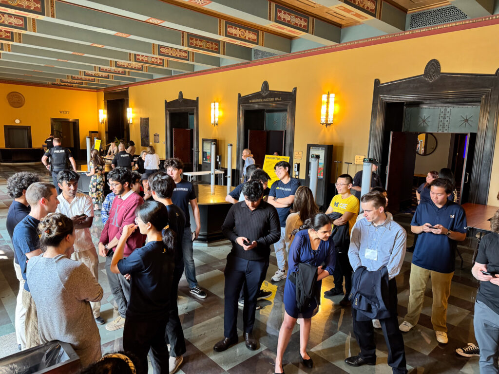 Students wait to take a selfie with Sam Altman.