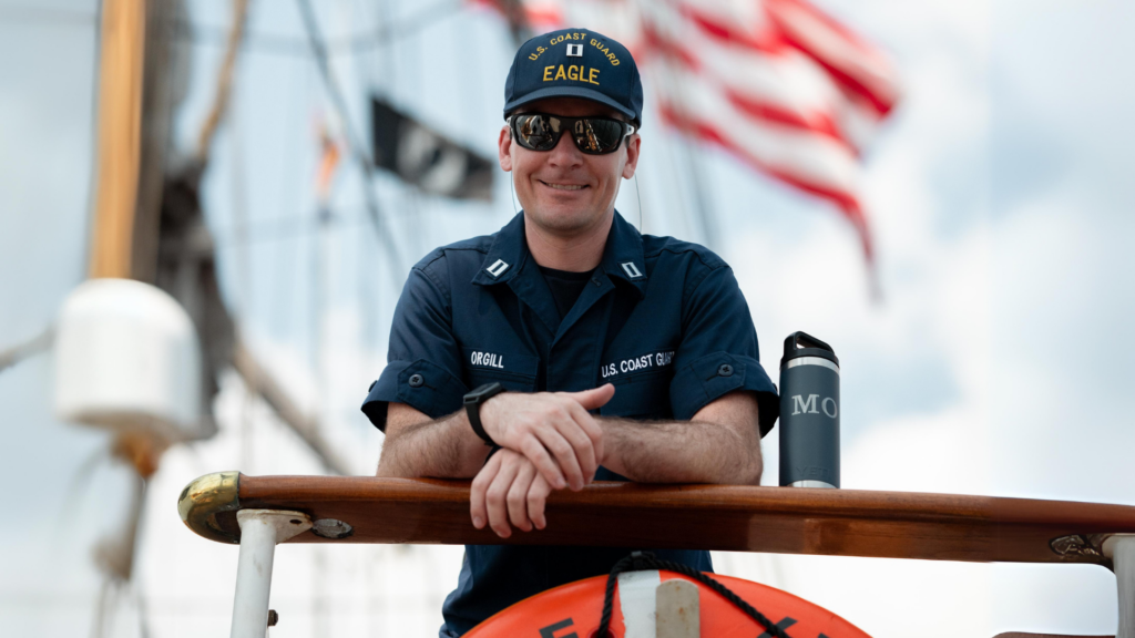 Matthew Orgill smiles aboard a ship.