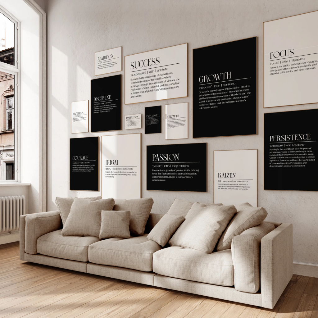 A variety of inspirational posters are shown on a wall, all in black and white. They contain entrepreneurial words and definitions.