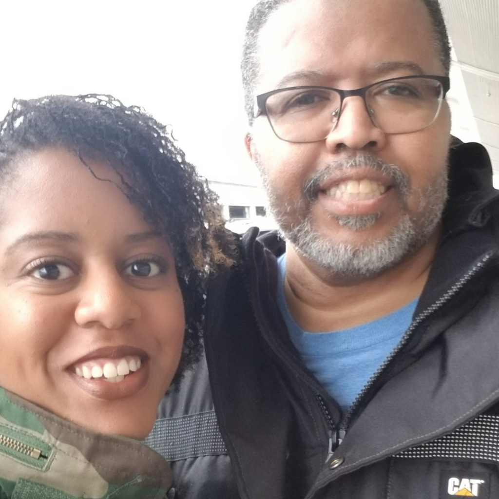 Olivia poses with her father, Eric.