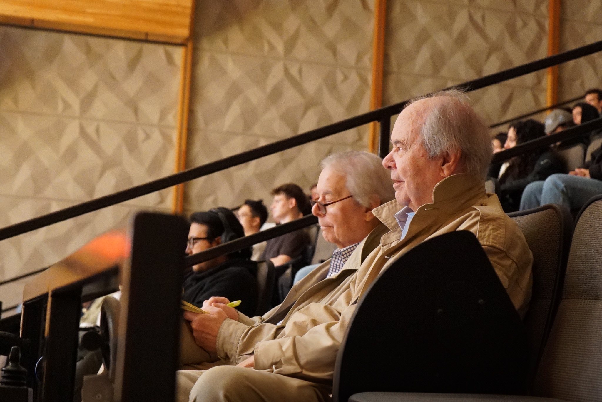 The Smith twins are seen in the audience at EHour, fully engaged in the session.
