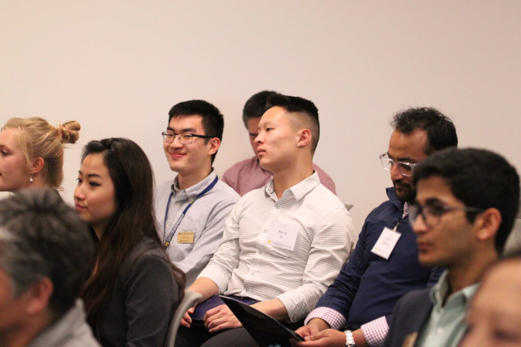 Arthur shi in a group of students listening to a lecture