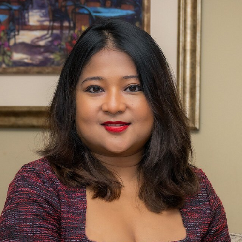 Prita Gogoi smiles for a headshot.