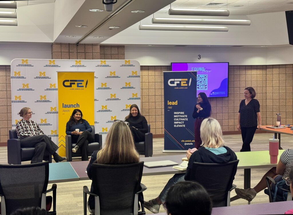 Priya Gogoi (Co-Founder of Celsee, Inc.), Madeline Eiken, and Charlie Childs (Co-Founders of Intero Biosystems) sitting in front of learn launch lead signs at the foundhers event in october