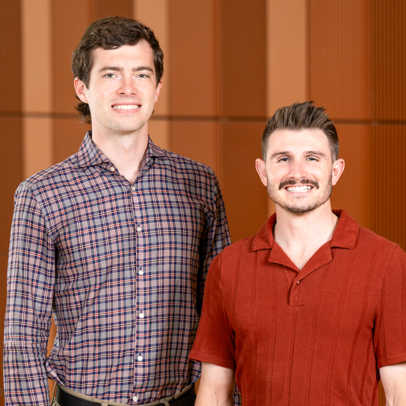 Stitichi CEO Everest in a plaid button down shirt with Kyle Wright in a red polo