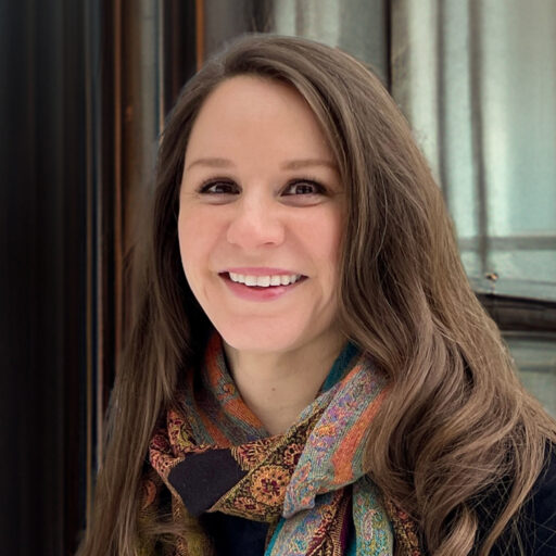 lindsay headshot a woman with light brown hair wearing a colorful scarf