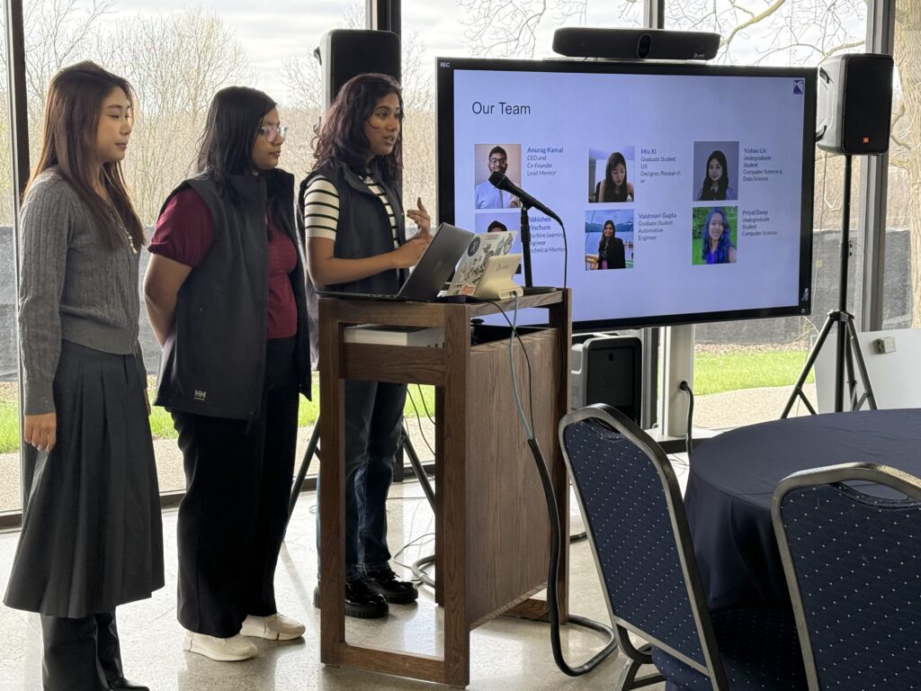 A group of students doing a presentation in front of the clasee