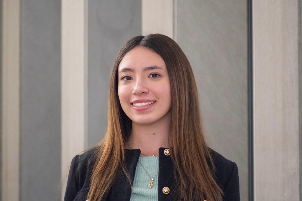 Ivana Vera Sánchez smiles while posing for a professional headshot.