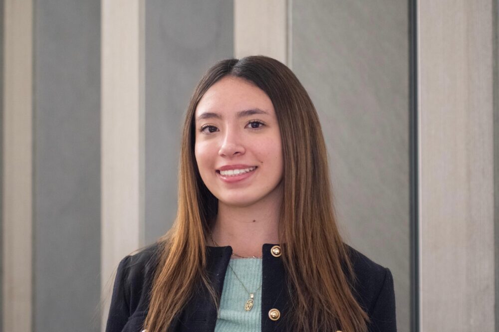 Ivana Vera Sánchez smiles while posing for a professional headshot.