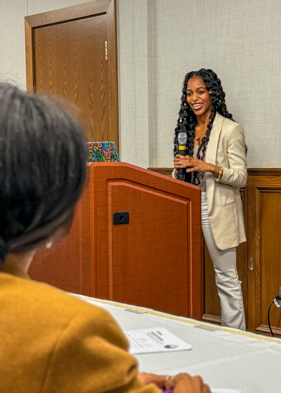 A student in front of a group of judges giving a pitch