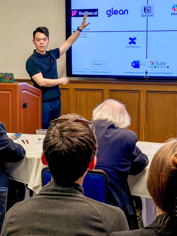 a student putting his presentation in front of the mtank judges