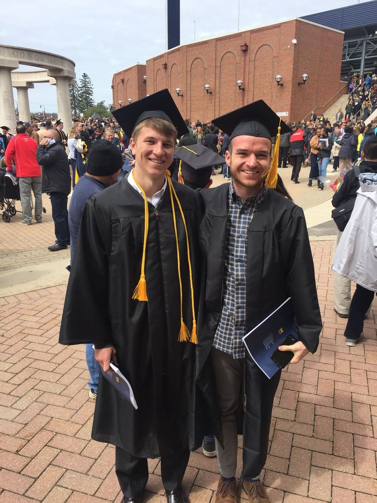Ty poses with Joe Saginaw at graduation at the Big House.