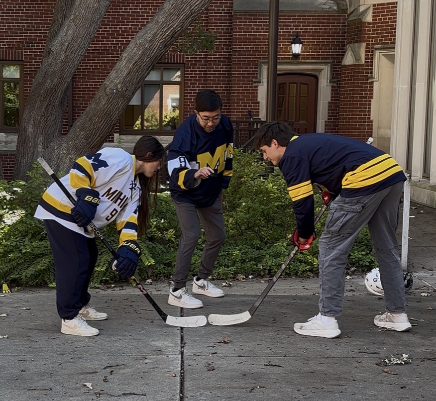 Isaac goes face-to-face with Sara Outman, a player on the Michigan Women's Hockey team, for a Ticko promotional video.