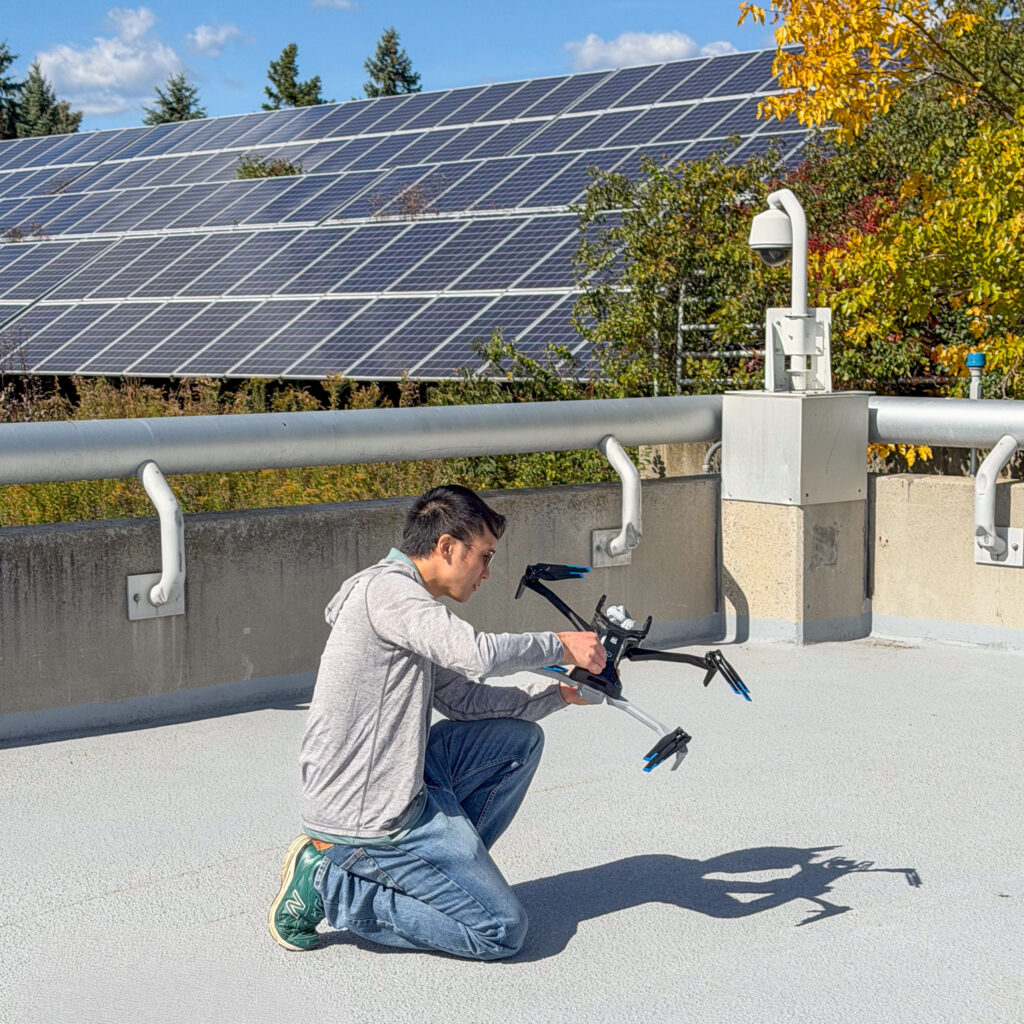 a man on a roof with a drone