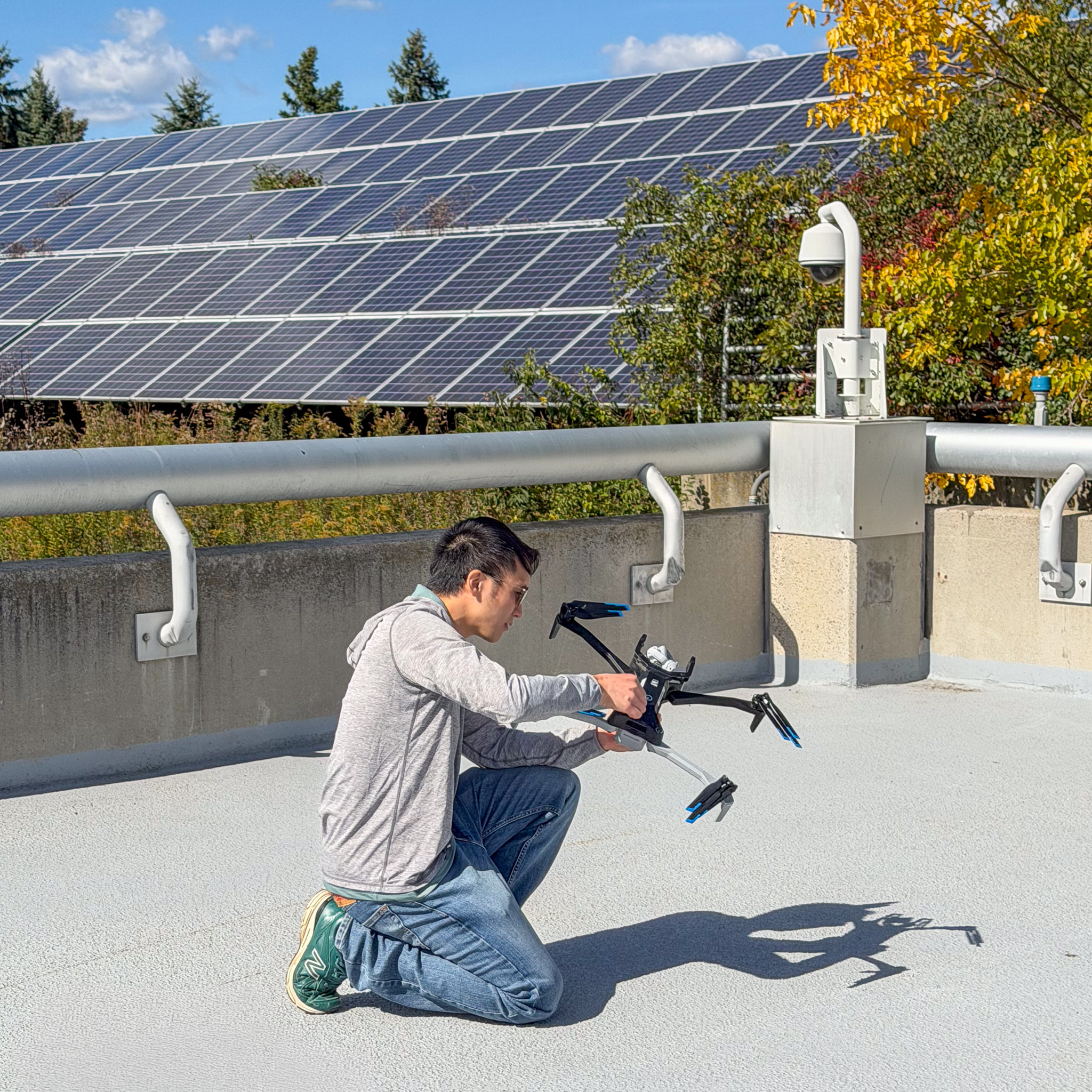 a man on a roof with a drone